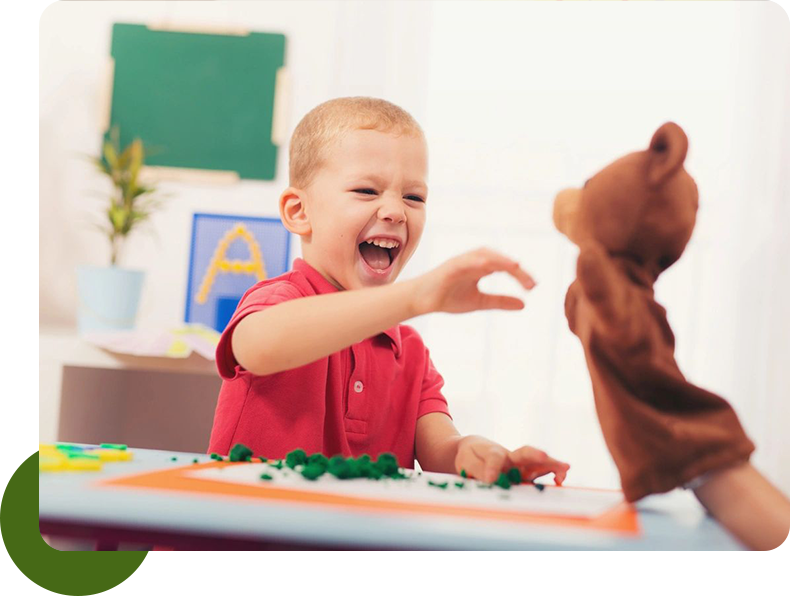 A child playing with a teddy bear toy.